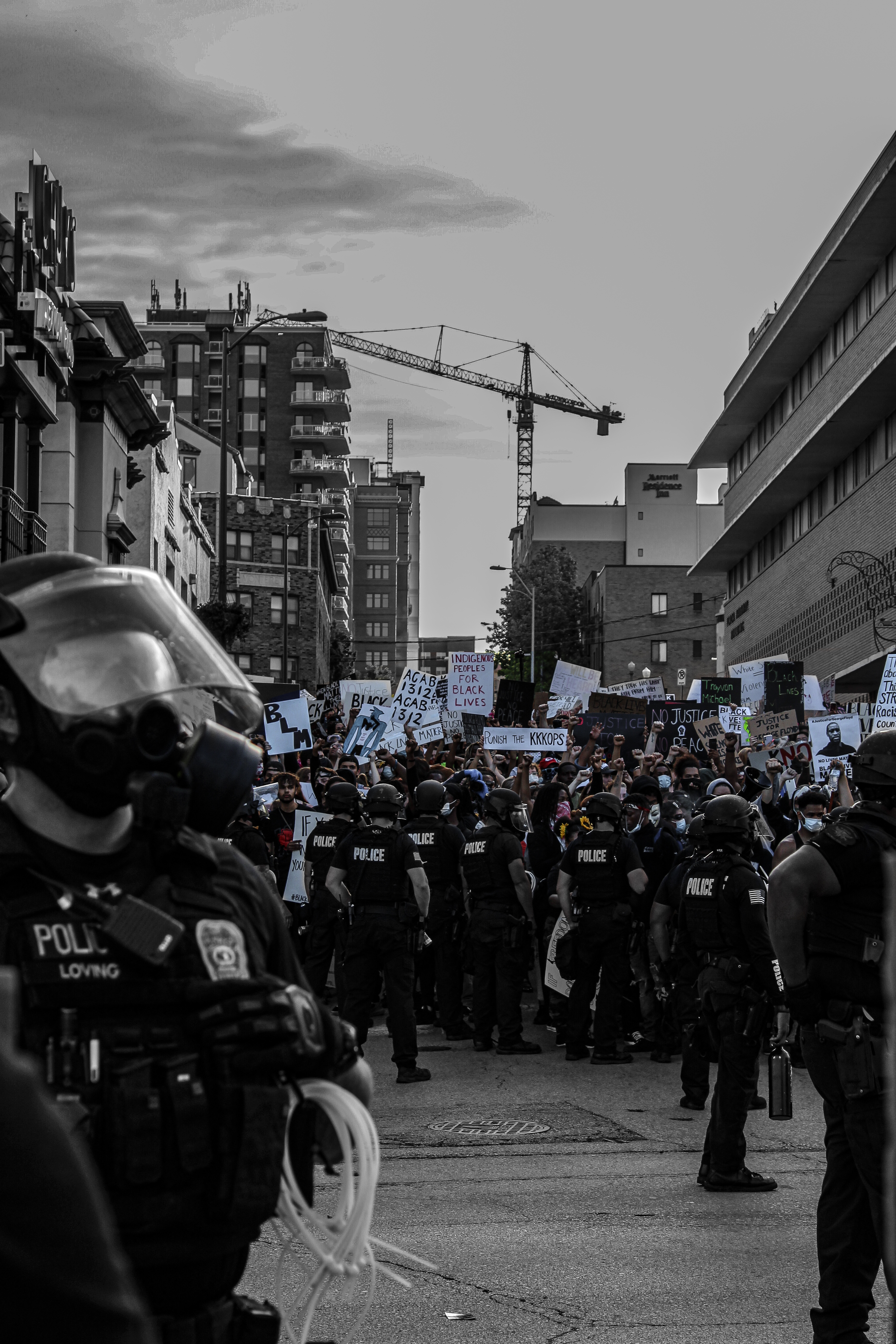 A crowd of protesters and police