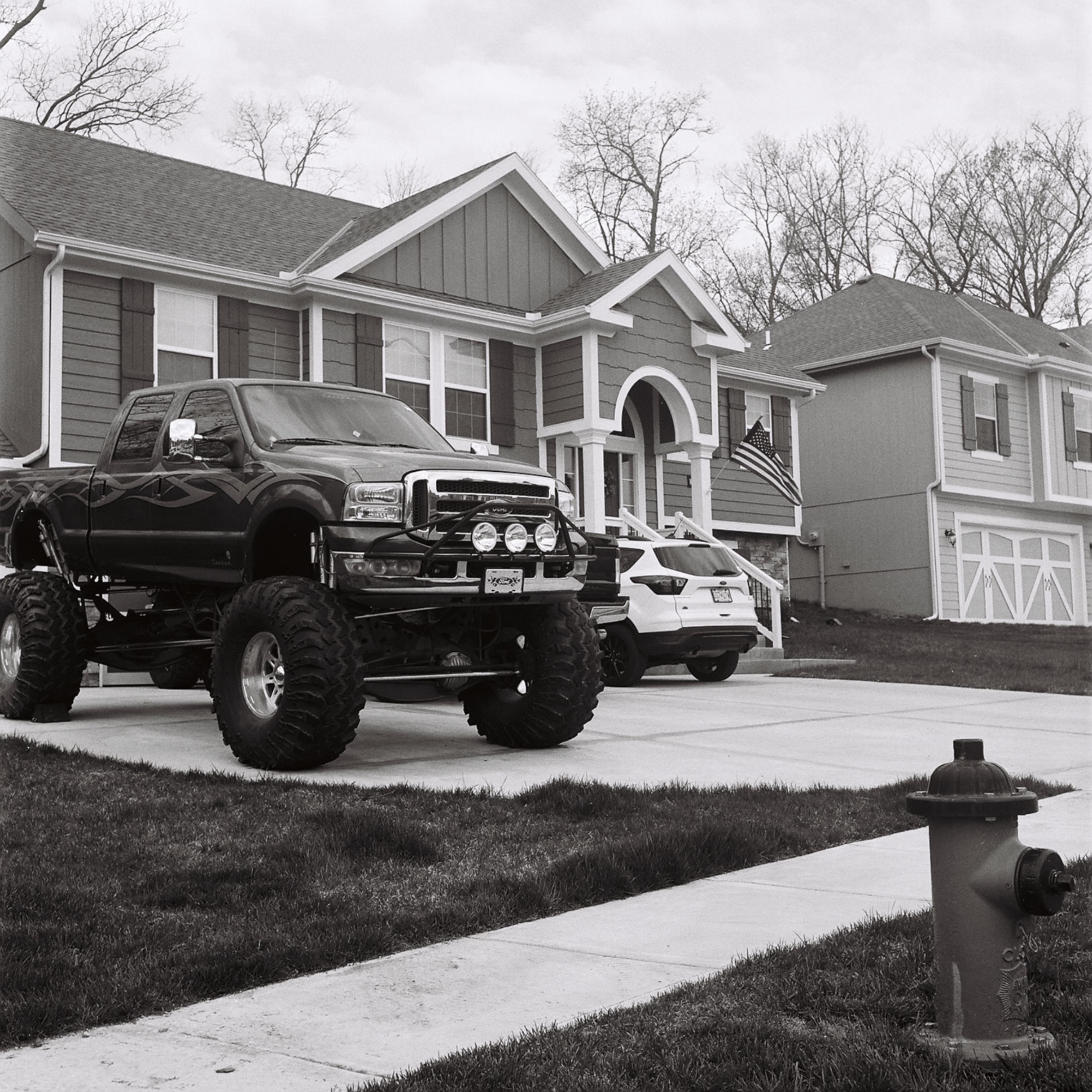 A large truck in front of a house